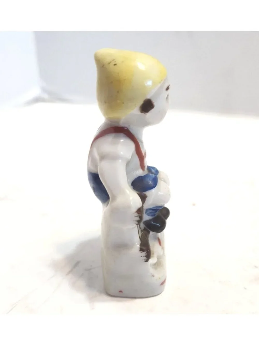 Vintage Mini Hand-Painted Porcelain Figurine Of A Boy Sitting On A Bench READ